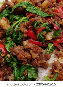 Stir-fried beef with basil, Thai food, spicy - Shutterstock ID 2395441615