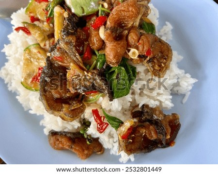 Stir-fried catfish with chilli paste served with rice