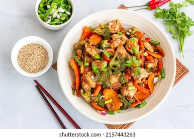 Stir-Fried Chicken And Vegetables In A Bowl With Chopsticks Top Down Photo, Healthy Asian Food Photography