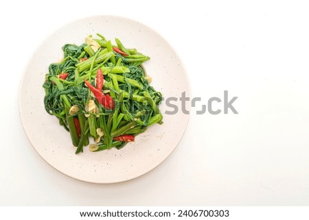 Stir-Fried Chinese Morning Glory or Water Spinach isolated on white background