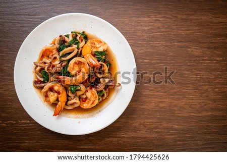 stir-fried seafood (shrimps and squid) with Thai basil - Asian food style