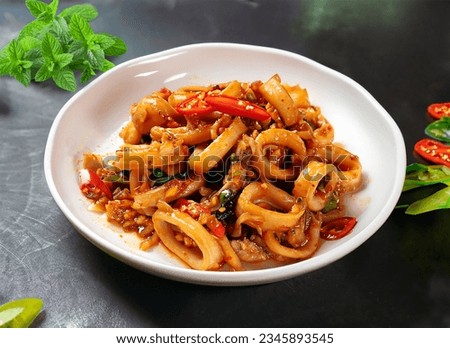 Stir-fried squid with roasted chili paste, salt egg yolk - Asian food style 