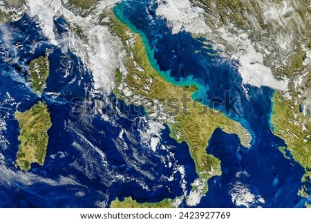 Stirring Up Adriatic Waters. Discolored water near the Italian coast suggests either a phytoplankton bloom or suspended sediment. Elements of this image furnished by NASA.