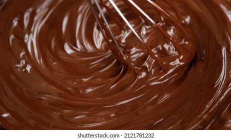 Stirring Melted Liquid Chocolate With Steel Whisk. Mixing Molten Chocolate Or Dark Caramel. Cooking Chocolate Dessert