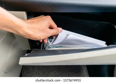 Stirring Papers In A Glove Box