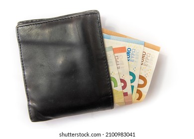 stitched leather pocket wallet showing a wad of euro banknotes from the europa series (5, 10, 20 and 50 euros), showing a large spending of money on a white background
