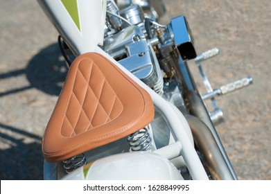 stitched leather saddle on low rider chopper motorcycle - Powered by Shutterstock