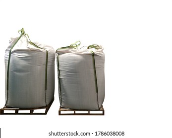 Stock Chemical fertilizer Urea jumbo-bag in a warehouse waiting for shipment. Put on wooden pallets on the White Background 