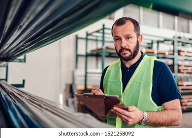 Stock Clerk Processing Order For Shipment In The Warehouse Factory