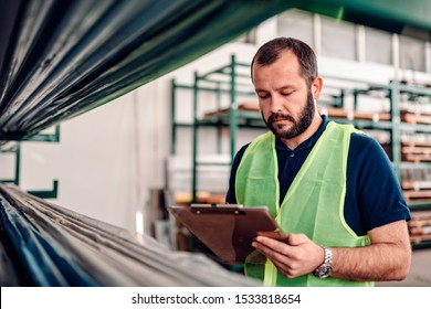 Stock Clerk Processing Order For Shipment In The Warehouse Factory