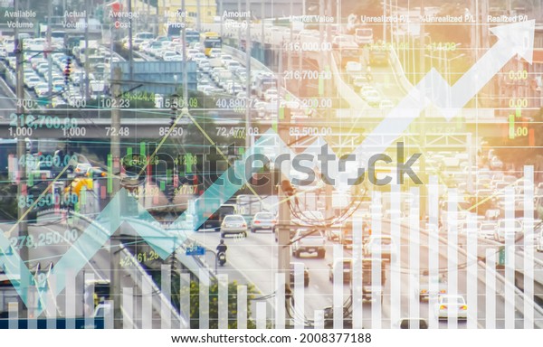 Stock financial index data with graph and\
chart show successful growth investment on transportation industry\
with blurry image of traffic density in the city for presentation\
and report background.\
