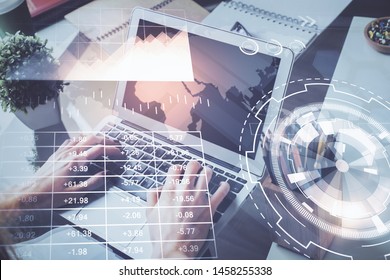 Stock graph with businessman typing on computer in office on background. Concept of analysis. Double exposure. - Shutterstock ID 1458255338