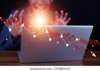 Stock graph falling on the background of failed businessman economic recession concept High inflation and rising interest rates