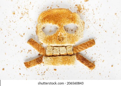 Stock image image of bread skull and crossbones with crumbs on white background