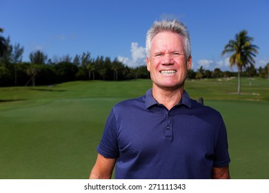 Stock Image Of A Golfer With A Cheesy Grin