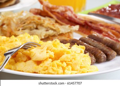 Stock image of hearty breakfast, focus on foreground.