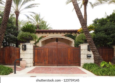 Stock image of a luxurious Single Family Home with a wooden gate