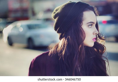 Stock Image Portrait Of Urban Teen Walking Outdoors With A Blank Stare