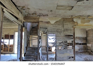 A Stock Image Showing An Old Abandoned House Interior After Years Of Neglect. Wooden Lattice Work Are Keeping The Walls Up. Mold And Structural  Foundation Issues.