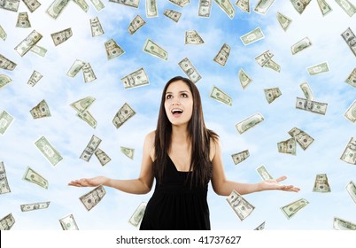 Stock Image Of Woman Standing With Open Arms Amidst Falling Money