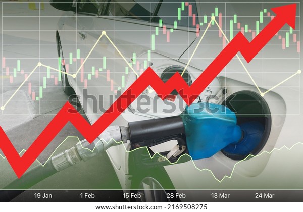 Stock index\
financial data diagram with big red arrow up, graph, chart and\
candlesticks on image of filling up the white car gas tank for\
energy industrial and business\
background.\
