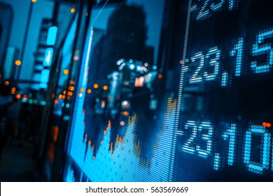 Stock Index Numbers With City Scene Reflect On Glass