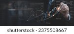 Stock market analysis, business, finance and investment. Finance analyst analyzing stock market trading graph, economic growth chart, planning and strategy, business investment with financial report