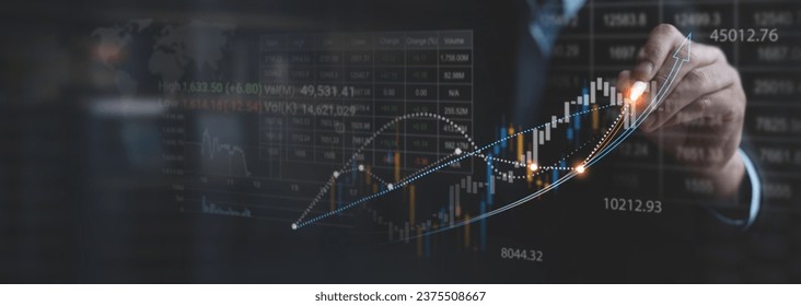 Stock market analysis, business, finance and investment. Finance analyst analyzing stock market trading graph, economic growth chart, planning and strategy, business investment with financial report - Powered by Shutterstock