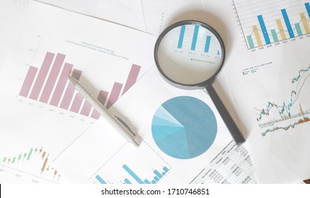 Stock Market Analysis magnifier graphics business - Shutterstock ID 1710746851