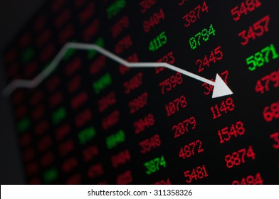 Stock Market - Arrow Graph Going Down On Display With Red And Green Figures