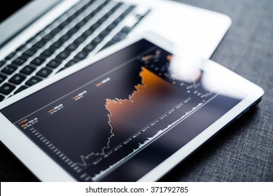 Stock market chart digital tablet - Shutterstock ID 371792785