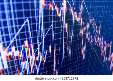 Stock market chart, graph on blue background. New modern computer and business strategy as concept. Financial diagram with candlestick chart used in market analysis for variation report of share price