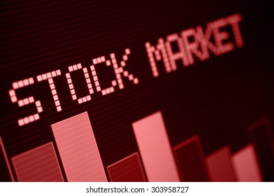 Stock Market - Column Going Down on Red Display - Shallow Depth Of Field