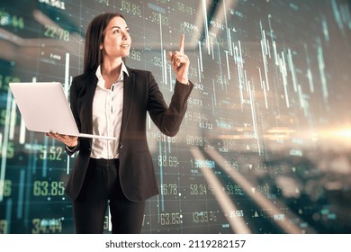 Stock Market Concept With Happy Trader Woman Carrying Laptop In Hand On Digital Screen Wall With Forex Chart Indicators, Numbers And Raising Up Arrows