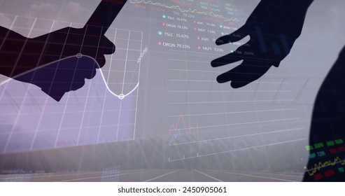 Stock market data processing against silhouette of hand passing a baton against sports field. sports competition and tournament concept - Powered by Shutterstock