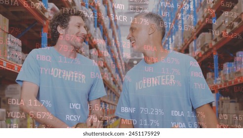 Stock market data processing over two caucasian male volunteers high fiving each other at warehouse. logistics and transportation business concept - Powered by Shutterstock