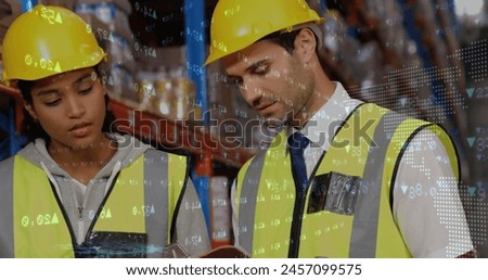 Stock market data processing over caucasian male and female supervisors discussing at warehouse. Global finance and logistics business concept