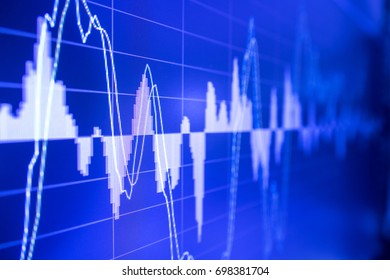 Stock market graph analysis. Stock market data on LED display on laptop screen for finance and economic. Business graph background. - Shutterstock ID 698381704