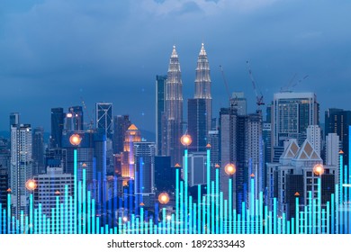 Stock Market Graph Hologram, Night Panorama City View Of Kuala Lumpur. KL Is Popular Location To Gain Financial Education In Malaysia, Asia. The Concept Of International Research. Double Exposure.