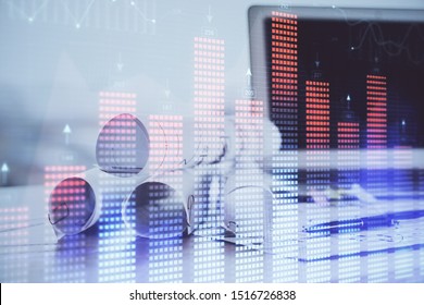 Stock market graph on background with desk and personal computer. Double exposure. Concept of financial analysis. - Shutterstock ID 1516726838