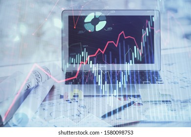 Stock market graph and table with computer background. Double exposure. Concept of financial analysis.