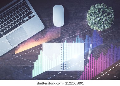 Stock Market Graph And Top View Computer On The Table Background. Double Exposure. Concept Of Financial Education.