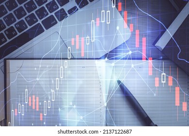 Stock Market Graph And Top View Computer On The Table Background. Multi Exposure. Concept Of Financial Education.