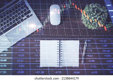 Stock market graph and top view computer on the table background. Double exposure. Concept of financial education. - Shutterstock ID 2138844179