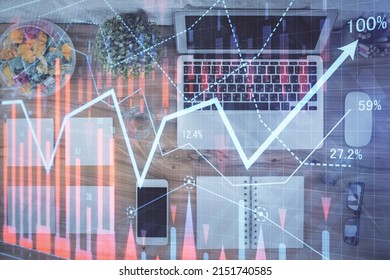 Stock Market Graph And Top View Computer On The Table Background. Multi Exposure. Concept Of Financial Education.