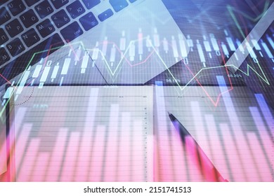 Stock Market Graph And Top View Computer On The Table Background. Multi Exposure. Concept Of Financial Education.