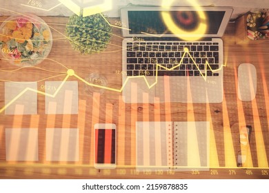 Stock Market Graph And Top View Computer On The Table Background. Multi Exposure. Concept Of Financial Education.