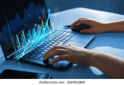 Stock market investment.  Financial and banking Technology.Businessman analysing economic growth graph financial data on laptop.Business strategy and digital marketing concept.  - Shutterstock ID 2069852885
