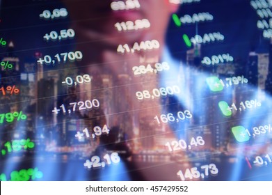 Stock market trading floor concept. Stock tickers, market quotes at blue background and the reflection of thinking trader. 