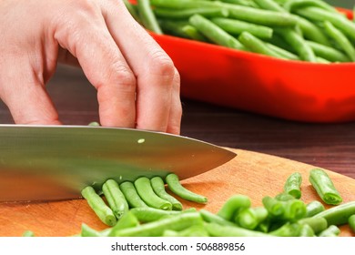 Stock Up On Winter Food. Chef Cutting Beans Cooking.